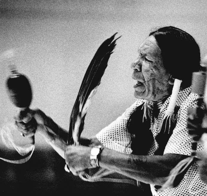 Saginaw Grant performs a gourd dance